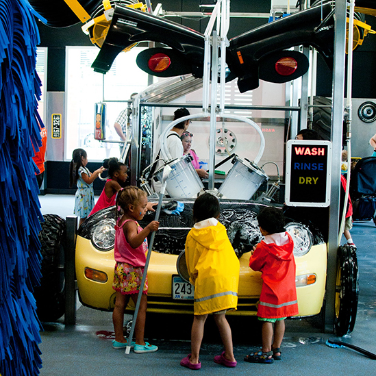 children playing with a play carwash